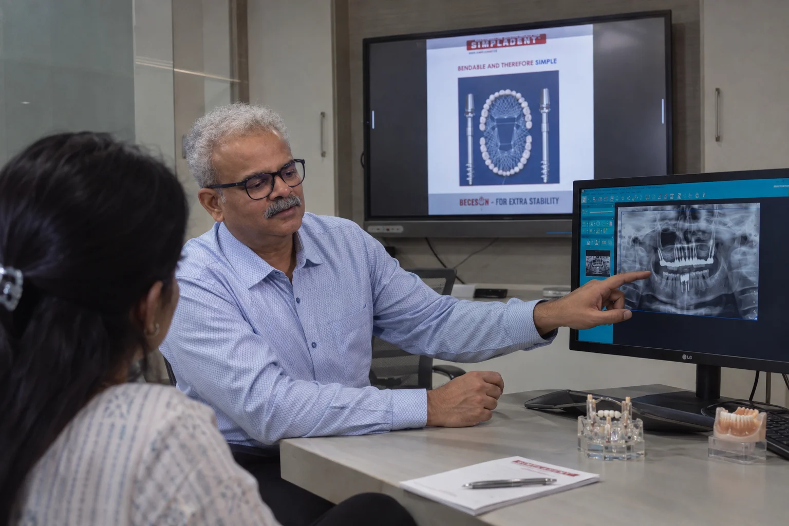 Dr. Vivek Gaur explaining 3D OPG X-ray evaluation and treatment plan
